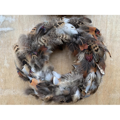 132 - TWO SMALL FEATHER WREATHS 20CM IN DIAMETER + VAT TO BE SOLD FOR THE PAIR