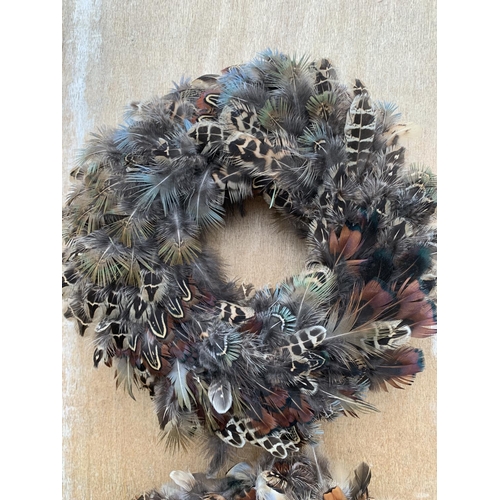 133 - TWO MEDIUM FEATHER WREATHS 25CM IN DIAMETER + VAT TO BE SOLD FOR THE PAIR