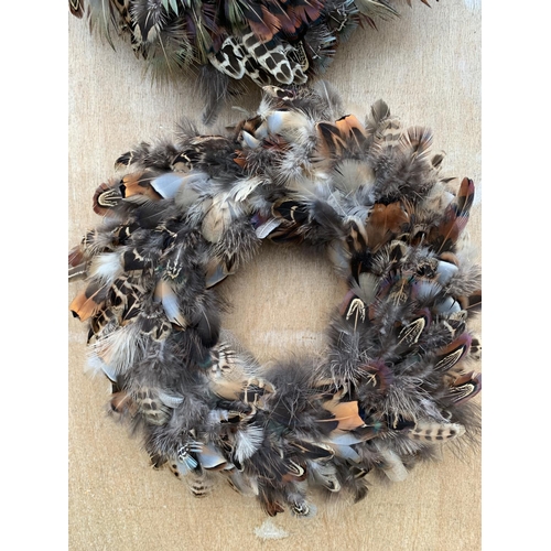 133 - TWO MEDIUM FEATHER WREATHS 25CM IN DIAMETER + VAT TO BE SOLD FOR THE PAIR