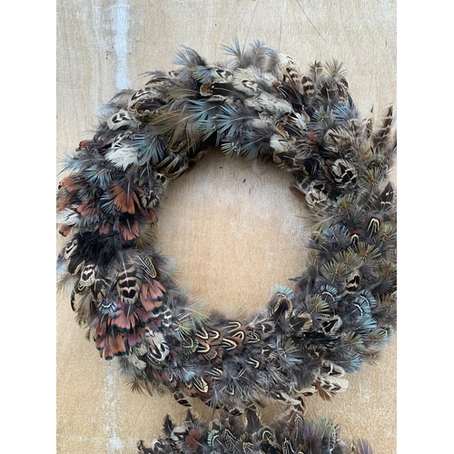 135 - TWO LARGE FEATHER WREATHS 35CM IN DIAMETER + VAT TO BE SOLD FOR THE PAIR