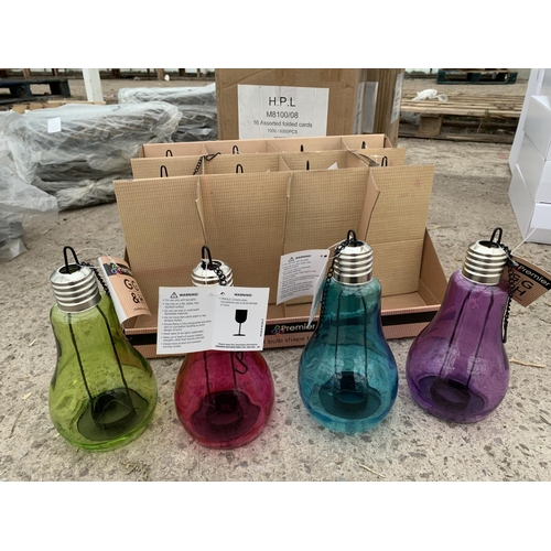 147 - TWELVE 17CM LIGHT BULB SHAPE TEA LIGHT HOLDERS MULTI COLOURED + VAT. TO BE SOLD FOR THE TWELVE