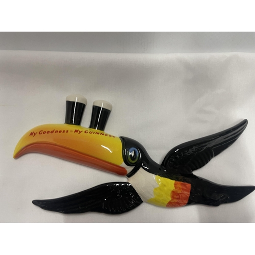 768 - A SET OF THREE GRADUATED CARLTON WARE GUINNESS TOUCANS IN FLIGHT WALL HANGING DECORATIONS