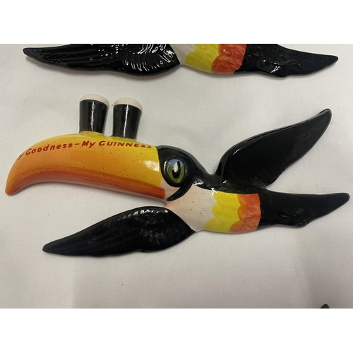 768 - A SET OF THREE GRADUATED CARLTON WARE GUINNESS TOUCANS IN FLIGHT WALL HANGING DECORATIONS