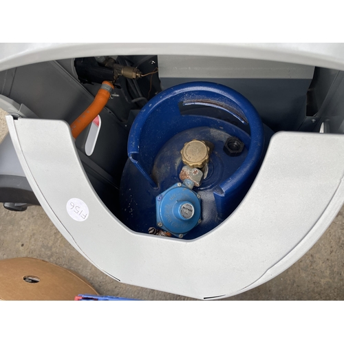 A DELONGHI GAS HEATER WITH GAS BOTTLE