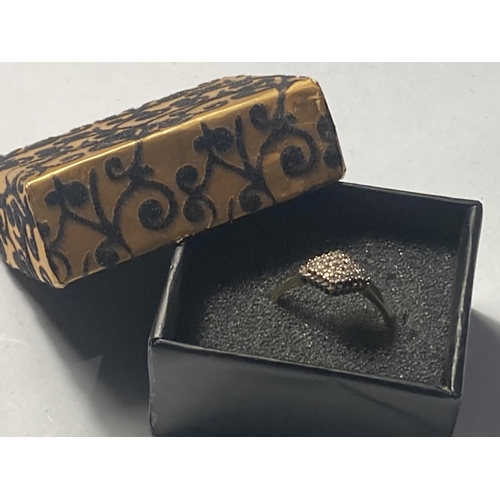 508 - A 9 CARAT GOLD RING WITH DIAMONDS SET IN A DIAMOND SHAPE SIZE R IN A PRESENTATION BOX