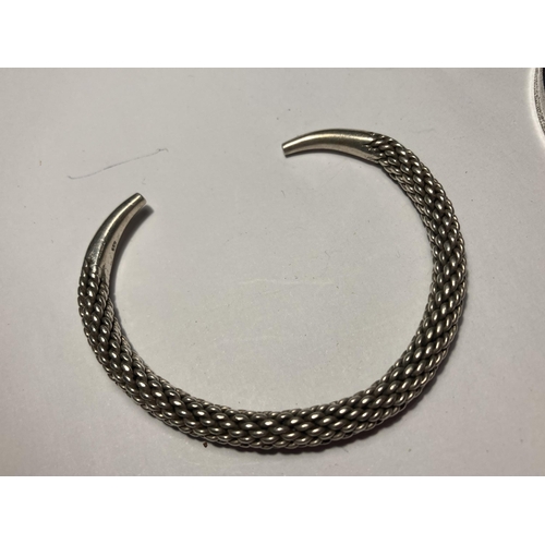 713 - THREE SILVER BANGLES