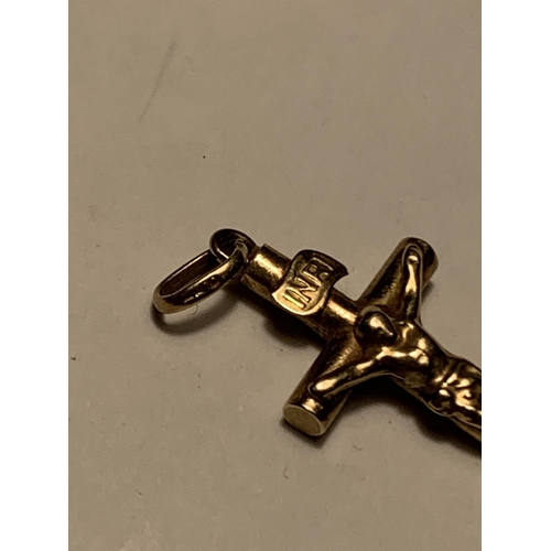 522A - A 9 CARAT GOLD CRUCIFIX GROSS WEIGHT 0.54 GRAMS