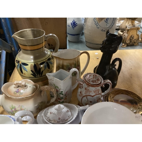 927 - A LARGE QUANTITY OF CERAMIC ITEMS TO INCLUDE JUGS, ORIENTAL PLATES AND BOWLS, TOAST RACKS, ETC