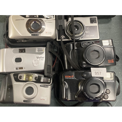 957 - A COLLECTION OF CAMERAS TO INCLUDE PRAKTICA, KONICA, CANON, OLYMPUS, ETC - 18 IN TOTAL