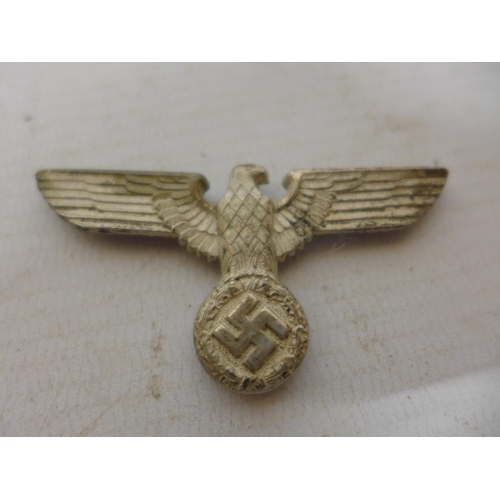 450 - A NAZI GERMANY BADGE, ENAMEL PARTY BADGE AND AN ARM BAND