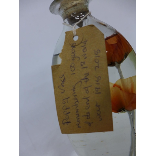 459 - AN UNUSUAL FIRST WORLD WAR COMMEMORATIVE POPPY BASE BOTTLE, WITH LABEL DATED 2018, HEIGHT 29.5CM