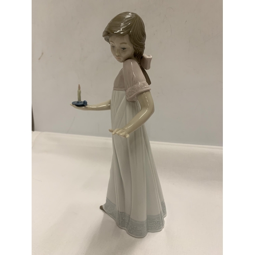 792 - A NAO FIGURE OF A GIRL HOLDING A CANDLE