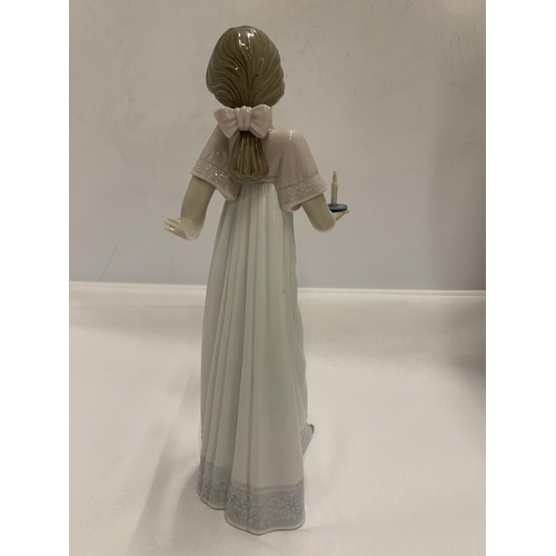 792 - A NAO FIGURE OF A GIRL HOLDING A CANDLE