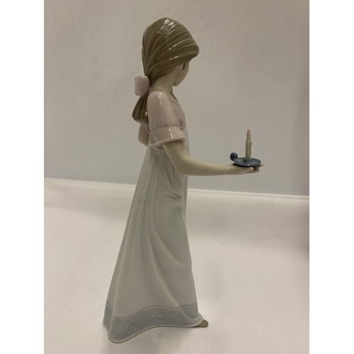 792 - A NAO FIGURE OF A GIRL HOLDING A CANDLE