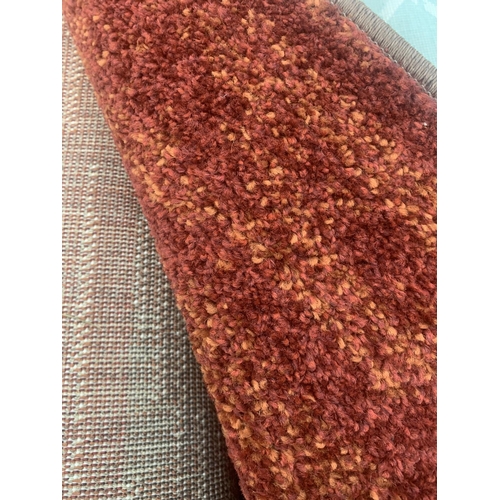 2486 - A LARGE BROWN PATTERNED RUG