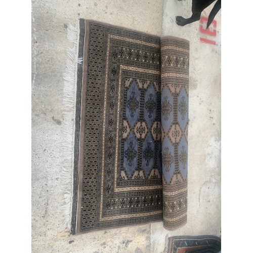 2489 - A BROWN PATTERNED FRINGE RUG