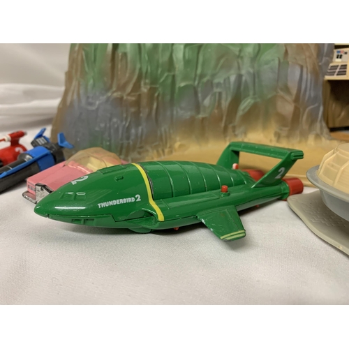 391 - A THUNDERBIRDS TRACEY ISLAND PLAYSET WITH A SET OF RESCUE SHIPS ETC.,