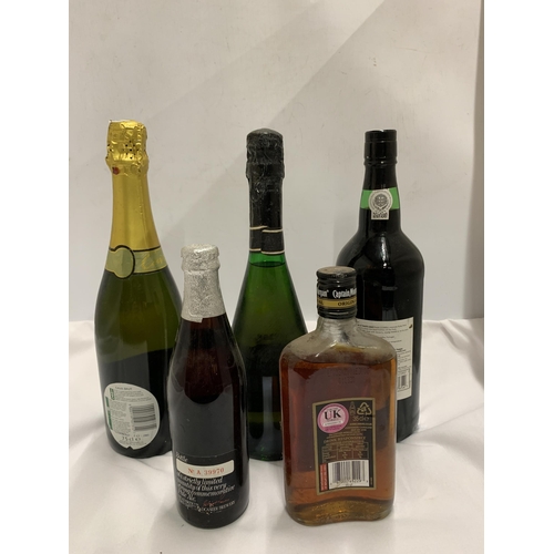 580 - FIVE MIXED BOTTLES - CAVA, 35CL CAPTAIN MORGAN RUM, ROYAL WEDDING ALE, RUBY PORT AND GERMAN BOTTLE