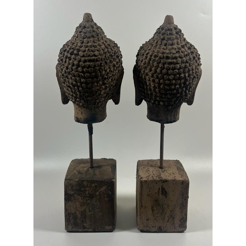 111 - A PAIR OF DECORATIVE STONE BUDDHA HEADS ON PLINTHS, HEIGHT 30 CM