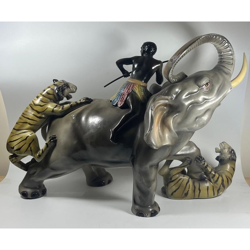 68 - A LARGE 1970S ITALIAN POTTERY SCULPTURE OF AN ELEPHANT BEING ATTACKED BY TIGERS, LENGTH 49 CM