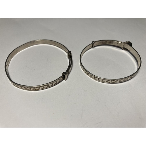 737 - FOUR SILVER BABY BANGLES