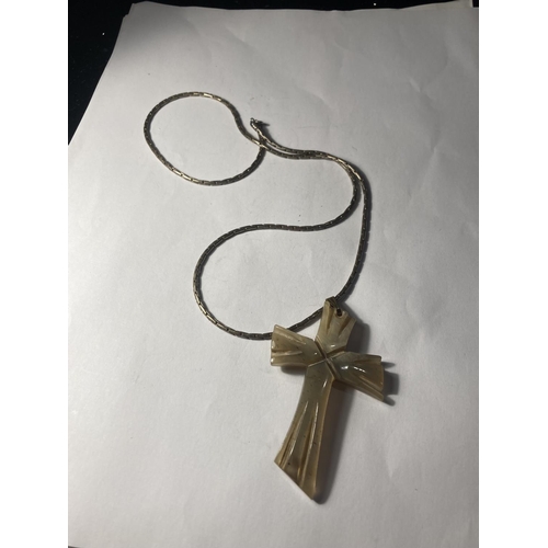 765 - A BONE CROSS AND SILVER NECKLACE