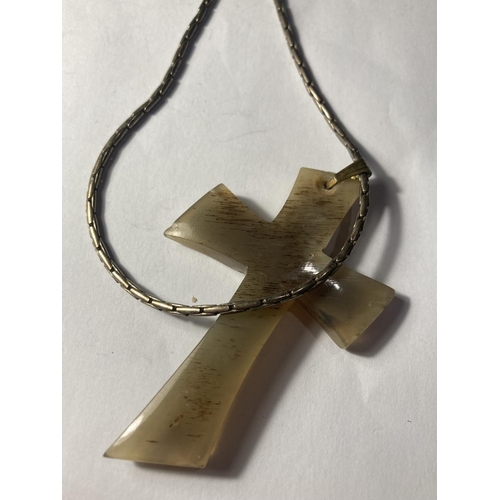 765 - A BONE CROSS AND SILVER NECKLACE