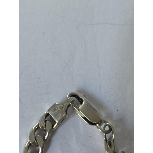 807 - A SILVER FIGARO WRIST CHAIN