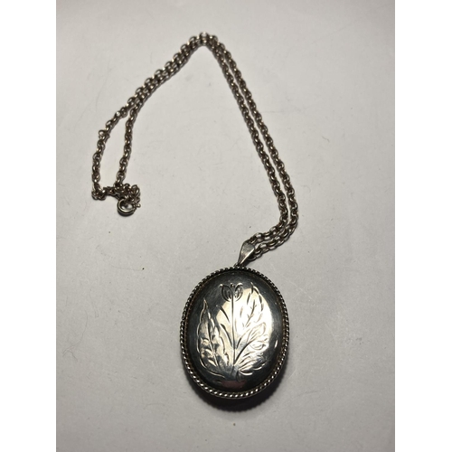 825 - A HALLMARKED BIRMINGHAM SILVER LOCKET WITH CHAIN