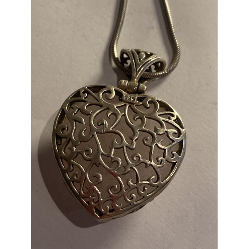 828 - A SILVER HEART SHAPED PURPLE STONE PENDANT WITH SILVER NECKLACE IN A PRESENTATION BOX