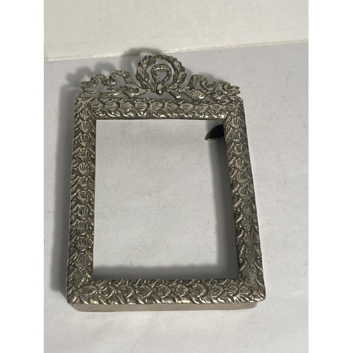 97 - A DECORATIVE SILVER SMALL PHOTOGRAPH FRAME NO GLASS