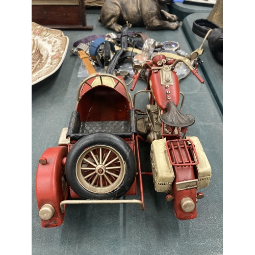 132 - A TIN PLATE MOTOR BIKE AND SIDE CAR MODEL