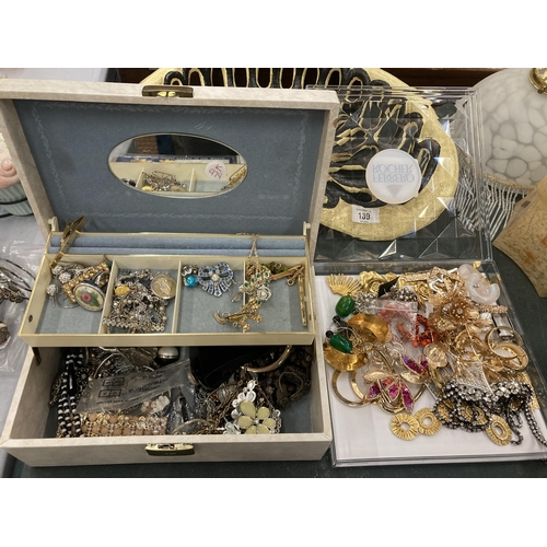 140 - A LARGE COLLECTION OF ASSORTED COSTUME JEWELLERY IN JEWELLERY BOX AND FURTHER CASE