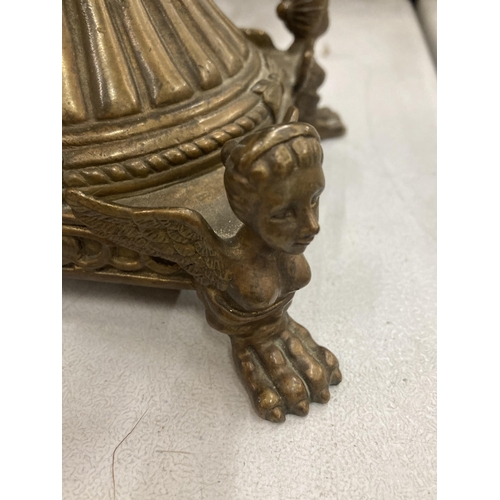 158 - A VINTAGE CERAMIC AND BRASS MOUNTED PEDESTAL URN VASE WITH PAW FEET BASE AND GIRL MASK HANDLE DESIGN