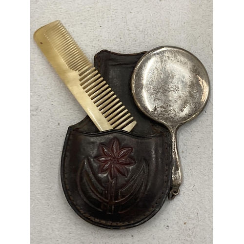 168 - A VINTAGE SILVER PLATED VANITY SET IN A TOOLED LEATHER SLEEVE