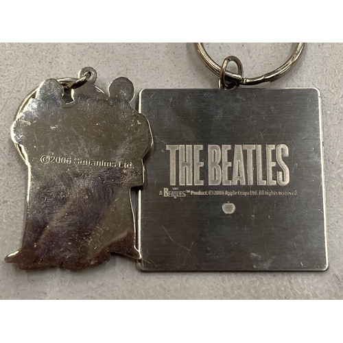 169 - TWO BEATLES KEYRINGS, DATED 2006