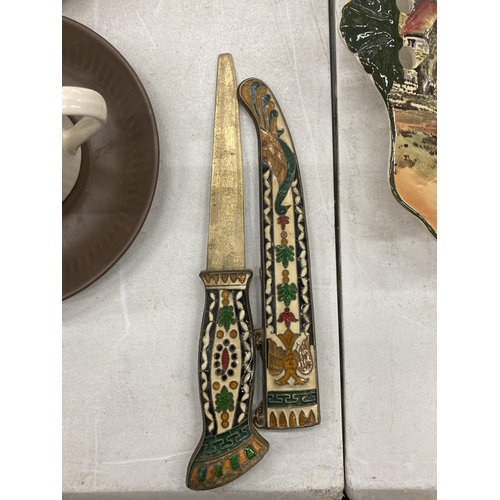 179 - AN ORNATE ENAMEL DESIGN DAGGER AND SCABBARD