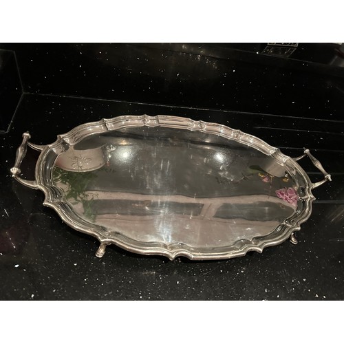 1 - A LARGE TWIN HANDLED HALLMARKED CHESTER SILVER TRAY WITH FOUR FEET GROSS WEIGHT 2923 GRAMS