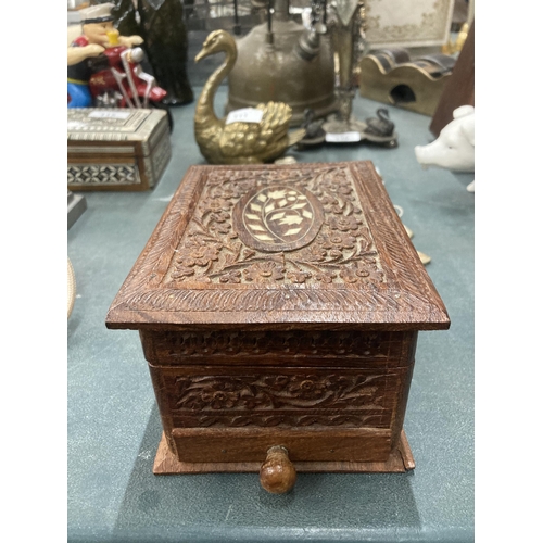 112A - A MIDDLE EASTERN CARVED AND INLAID WOODEN BOX