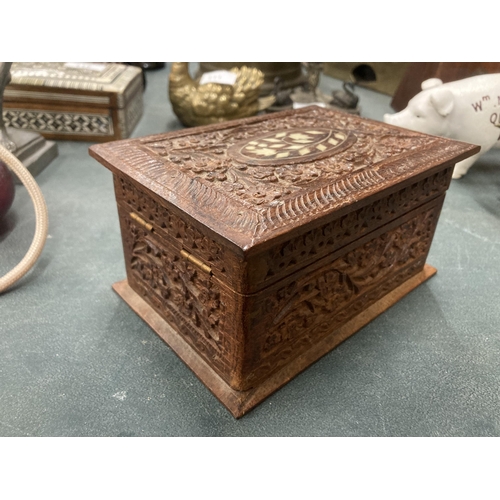 112A - A MIDDLE EASTERN CARVED AND INLAID WOODEN BOX