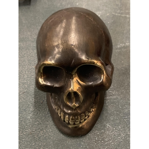 117A - A SMALL BRONZE SKULL MODEL