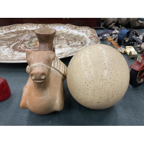 134A - TWO ITEMS - TERRACOTTA HORSE JUG AND AN OSTRICH EGG