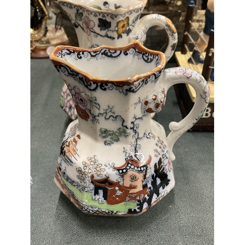 228 - A SET OF THREE MASONS IRONSTONE HYDRA JUGS