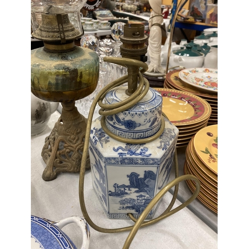 246 - TWO VINTAGE LAMPS - CHINESE BLUE AND WHITE AND EXAMPLE WITH CAST METAL BASE