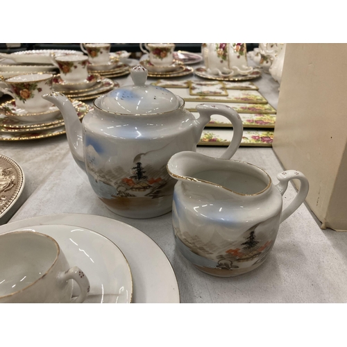 258 - AN ORIENTAL TEASET TO INCLUDE A TEAPOT, CREAM JUG, CUPS, SAUCERS AND PLATES