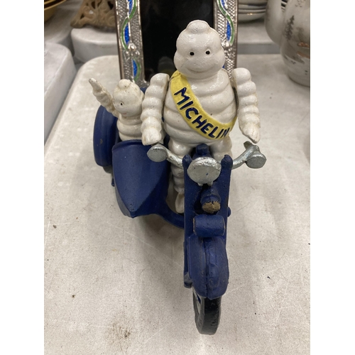 290 - A CAST METAL MICHELIN MAN ON MOTORBIKE FIGURE