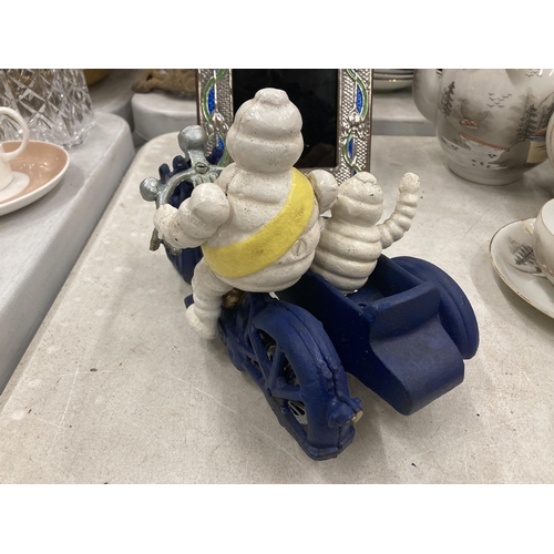 290 - A CAST METAL MICHELIN MAN ON MOTORBIKE FIGURE