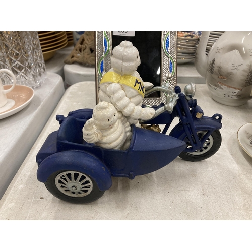 290 - A CAST METAL MICHELIN MAN ON MOTORBIKE FIGURE