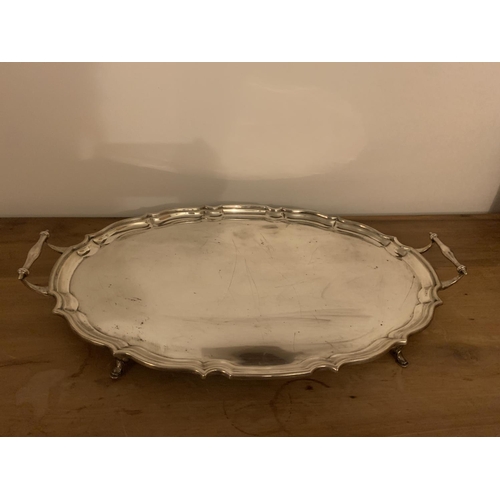 1 - A LARGE TWIN HANDLED HALLMARKED CHESTER SILVER TRAY WITH FOUR FEET GROSS WEIGHT 2923 GRAMS