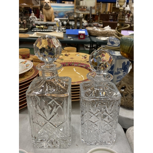 1201 - A SET OF SIX SUSIE COOPER COFFEE CUPS AND SAUCERS TOGETHER WITH TWO CUT GLASS DECANTERS